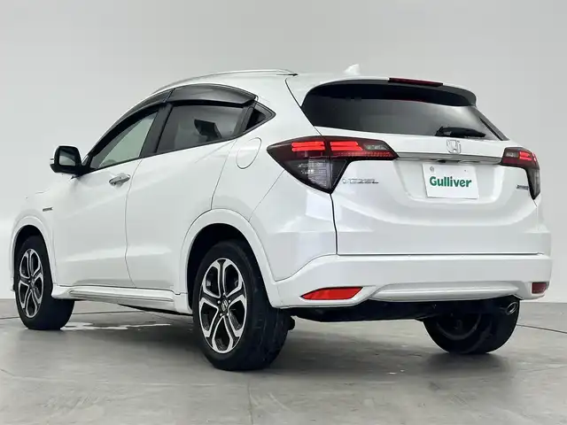 ホンダ ヴェゼル ハイブリッド Z ホンダセンシング 愛知県 2021(令3)年 4.5万km プラチナホワイトパール ・純正9インチナビ/・Bluetooth/・バックカメラ/・フルセグTV/・ホンダセンシング/・衝突被害軽減システム/・クルーズコントロール/・コーナーセンサー/・レーンキープアシスト/・オートライト/・LEDフォグランプ/・シートヒーター/・ETC/・純正AW/・純正フロアマット/・プッシュスタート/・スマートキー