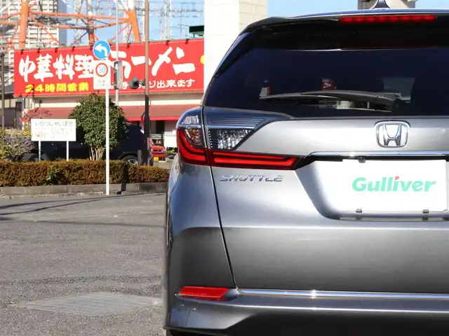 ホンダ シャトル ハイブリッド X ホンダセンシング 神奈川県 2021(令3)年 1.5万km シャイニンググレーM 純正メモリナビ/バックカメラ/Bluetooth/ナビ連動ドラレコ（前後）/アダプティブクルーズコントロール/ステアリングスイッチ/パドルシフト/プッシュスタート/ETC（ビルトイン）/USBジャック/LEDヘッドライト/シートヒーター（運転席、助手席）/保証書/スペアスマートキー