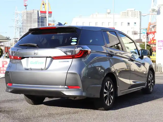 ホンダ シャトル ハイブリッド X ホンダセンシング 神奈川県 2021(令3)年 1.5万km シャイニンググレーM 純正メモリナビ/バックカメラ/Bluetooth/ナビ連動ドラレコ（前後）/アダプティブクルーズコントロール/ステアリングスイッチ/パドルシフト/プッシュスタート/ETC（ビルトイン）/USBジャック/LEDヘッドライト/シートヒーター（運転席、助手席）/保証書/スペアスマートキー