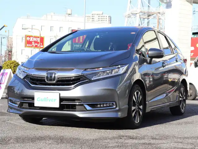 ホンダ シャトル ハイブリッド X ホンダセンシング 神奈川県 2021(令3)年 1.5万km シャイニンググレーM 純正メモリナビ/バックカメラ/Bluetooth/ナビ連動ドラレコ（前後）/アダプティブクルーズコントロール/ステアリングスイッチ/パドルシフト/プッシュスタート/ETC（ビルトイン）/USBジャック/LEDヘッドライト/シートヒーター（運転席、助手席）/保証書/スペアスマートキー