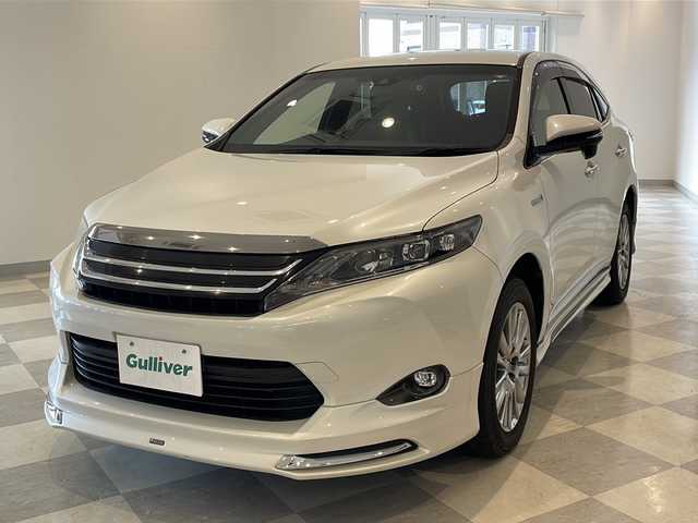 トヨタ ハリアー ハイブリッド プレミアム 福井県 2015(平27)年 8.1万km ホワイトパールクリスタルシャイン モデリスタエアロ/JLBサウンドシステム/純正8インチSDナビ/フルセグTV/BT/DVD/CD/SD/USB/AUX/バックカメラ/クルーズコントロール/プリクラッシュセーフティ/レーンキープアシスト/オートハイビーム/ETC/前後ドライブレコーダー/パワーバックドア/パワーシート/レザーシート/ウッドコンビステアリング/オートライト/LEDヘッドライト/クリスタルシフトノブ/純正シフトノブ車載/純正18インチアルミホイール/純正フロアマット/100V電源/MTモード付AT/プッシュスタート/スマートキー×2