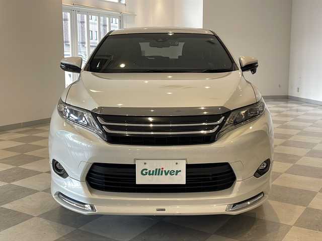 トヨタ ハリアー ハイブリッド プレミアム 福井県 2015(平27)年 8.1万km ホワイトパールクリスタルシャイン モデリスタエアロ/JLBサウンドシステム/純正8インチSDナビ/フルセグTV/BT/DVD/CD/SD/USB/AUX/バックカメラ/クルーズコントロール/プリクラッシュセーフティ/レーンキープアシスト/オートハイビーム/ETC/前後ドライブレコーダー/パワーバックドア/パワーシート/レザーシート/ウッドコンビステアリング/オートライト/LEDヘッドライト/クリスタルシフトノブ/純正シフトノブ車載/純正18インチアルミホイール/純正フロアマット/100V電源/MTモード付AT/プッシュスタート/スマートキー×2