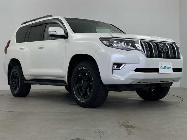 トヨタ ランドクルーザー プラド TX 鹿児島県 2019(令1)年 3.2万km ホワイトパールクリスタルシャイン ALPINE９型ナビ/（FM・AM/CD・DVD/BT/TV）/ALPINEスピーカー/バックカメラ/パーキングセンサー/社外フロアマット/リフトアップ/ETC/LDA/PCS/ACC/LEDヘッドライト/社外AW/フルセグTV/ホワイトレタータイヤ