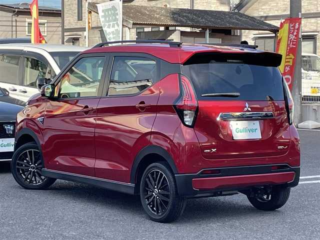 三菱 ｅＫクロス ＥＶ G 大分県 2023(令5)年 3.2万km レッドメタリック ワンオーナー/社外9インチメモリナビ MDV-M909HDL/　　【フルセグ/DVD/BTオーディオ】/全方位カメラ/社外15インチアルミホール/衝突被害軽減システム/イノベーティブペダル オペレーションモード/車線逸脱防止支援機能/電動パーキングブレーキ/ブレーキオートホールド/前後クリアランスソナー/デジタルインナーミラー/ドライブレコーダー/ETC2.0/LEDヘッドライト/オートライト/ヘッドライトレベライザー/レザーステアリング/ハンドルヒーター/チルトステアリング/ステアリングリモコン/前席シートヒーター/運転席シートリフター/エンジンプッシュスタート/ウインカーミラー/リアプライバシーガラス/フロアマット/電動格納ミラー/サイド＆Wエアバッグ/ABS/スマートキー×2/保証書/車両取説/ナビ取説