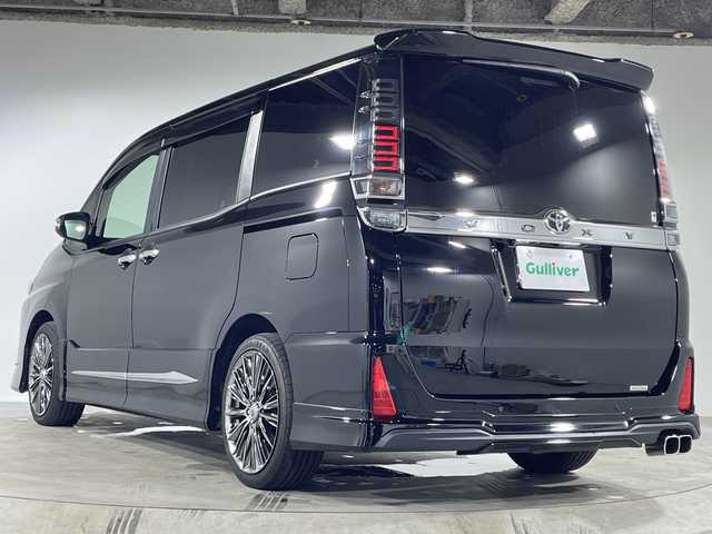 トヨタ ヴォクシー ZS 煌Ⅲ 福岡県 2021(令3)年 5.6万km ブラック フリップダウンモニター/モデリスタエアロ/純正10型ナビ/バックカメラ/フルセグ/トヨタセーフティセンス/両側パワースライドドア/前後ドライブレコーダーT‘Z/ビルトインETC/ハーフレザーシート/RAYS VERSUSアルミホイール/LEDヘッドライト/プッシュスタート/スマートキー×2