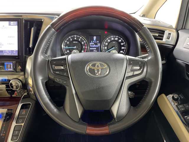 トヨタ ヴェルファイア V 神奈川県 2015(平27)年 7.3万km ホワイトパールクリスタルシャイン モデリスタエアロ【フロント/サイド/リア】/社外10型SDナビゲーション【EX10】/社外フリップダウンモニター/フルセグ　CD DVD　Bluetooth　SD　USB　HDMI/両側電動スライドドア【サンシェード】/パワーバックドア/クルーズコントロール/前後ソナー/木目調/革巻きコンビステアリング/ステアリングスイッチ/合皮/ファブリックコンビシート/前席パワーシート/運転席ポジションメモリー/助手席/2列目オットマン/ビルトインETC/社外前方ドライブレコーダー/電動パーキングブレーキ/オートブレーキホールド/プッシュスタート/スマートキー/LEDヘッド/フォグランプ/オートライト/電格ウインカーミラー