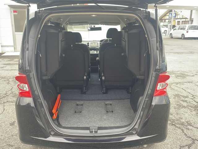 ホンダ フリード G ジャストセレクション 東京都 2010(平22)年 11.7万km プレミアムブラキッシュパール 純正ナビ/純正フロアマット/ドライブレコーダー/片側パワースライドドア（左側）/パワーウィンドウ/電動格納ミラー/ステアリングスイッチ/メーター照度調整スイッチ/シガーソケット/RCA入力端子/ビルトインETC/オートエアコン/三列シート/ウォークスルー