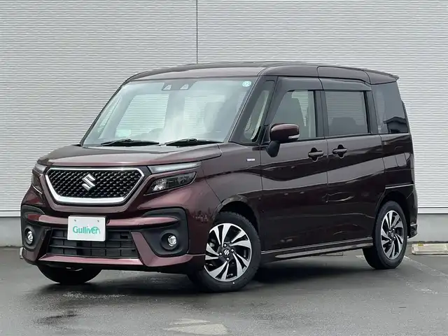 スズキ ソリオ バンディット HV MV 秋田県 2024(令6)年 1.1万km メロウディープレッドパール 純正ナビ・フルセグＴＶ・ＣＤ・DVD再生・Bluetooth・USB接続・AMFMチューナー/衝突被害軽減システム/コーナーセンサー/車線逸脱警報装置/フリップダウンモニター/前席シートヒーター/プッシュスタート・スマートキー/純正アルミホイール・スタッドレスタイヤ装着/LEDヘッドライト・フォグランプ/ダブル・サイド・カーテンエアバック/純正フロアマット/ウィンカーミラー