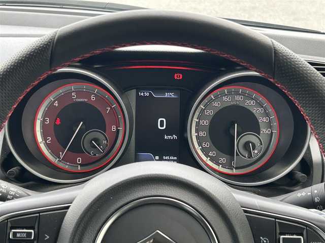 スズキ スイフト 滋賀県 2022(令4)年 2.3万km プレミアムシルバーメタリック ガソリン/2WD/6速MT/純正7インチナビ/【AN/FM/CD/DVD/TV/Bluetooth】/ETC/横滑り防止装置/運転席シートヒーター/クルーズコントロール/革巻きステアリング/ステアリングスイッチ/電動格納ミラー/オートライト/LEDヘッドライト/フロントフォグ/リアフォグ/オートエアコン/純正ドアバイザー/純正フロアマット/プッシュスタート/スマートキー/スペアキー/パワーステアリング