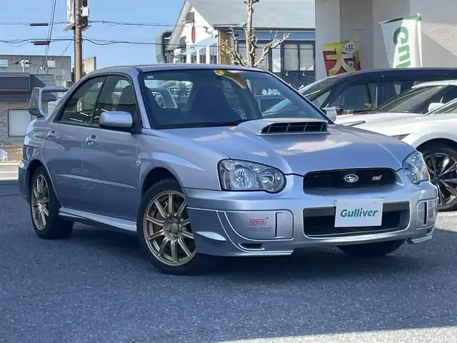 スバル インプレッサ ＷＲＸ STi 大阪府 2004(平16)年 16.2万km プレミアムシルバーメタリック 純正ナビ-ワンセグTV/CD/momoステアリング/HIDヘッドライト/ETC/6速ミッション