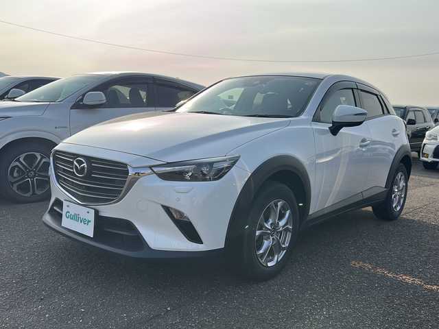 マツダ ＣＸ－３ 15S ツーリング 新潟県 2020(令2)年 1万km スノーフレイクホワイトパールマイカ 純正ナビ（CD・DVD・TV・BT）/コーナーセンサー/フロント・バックカメラ/ウインカーミラー/スマートキー/プッシュスタート/スマートシティブレーキサポート/パーキングセンター/インテリキー/３６０゜ビューモニター/横滑り防止装置/衝突被害軽減システム/レーンキープアシスト/パワーステアリング/パワーウィンドウ/アイドリングストップ/カーテンエアバック