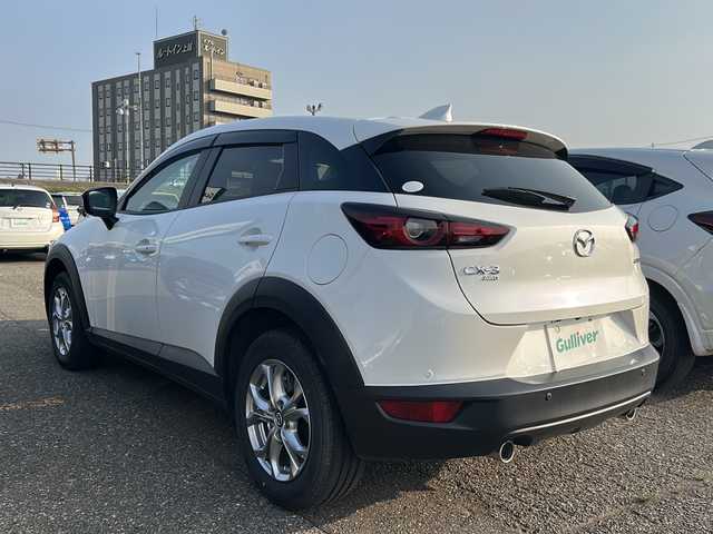 マツダ ＣＸ－３ 15S ツーリング 新潟県 2020(令2)年 1万km スノーフレイクホワイトパールマイカ 純正ナビ（CD・DVD・TV・BT）/コーナーセンサー/フロント・バックカメラ/ウインカーミラー/スマートキー/プッシュスタート/スマートシティブレーキサポート/パーキングセンター/インテリキー/３６０゜ビューモニター/横滑り防止装置/衝突被害軽減システム/レーンキープアシスト/パワーステアリング/パワーウィンドウ/アイドリングストップ/カーテンエアバック