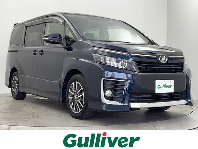 トヨタ ヴォクシー ZS 大阪府 2014(平26)年 6.5万km ブラッキッシュアゲハガラスフレーク フリップダウンモニター/ALPINEナビ　/・バックカメラ/・フルセグテレビ/ＤＶＤ/・AM/FM/BT　/両側電動スライドドア/レーダー探知機　（ＺＥＲＯ８４Ｖ）/ビルトインＥＴＣ　/純正フロアマット　/純正ドアバイザー　/純正１６インチＡＷ