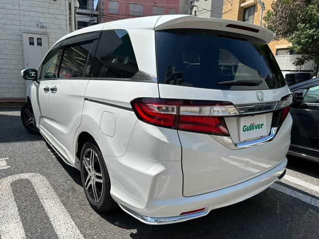ホンダ オデッセイ アブソルート 20thアニバーサリー 東京都 2015(平27)年 1.2万km ホワイトオーキッドパール 登録時走行11337km/ワンオーナー/ホンダセンシング/・CMBS（衝突軽減ブレーキ）/・誤発進抑制機能/・先行車発進お知らせ機能/・アダプティブクルーズコントロール/・LKAS（車線維持支援システム）/・路外逸脱抑制機能/・標識認識機能/インターナビ対応SDナビ/フルセグTV/バックカメラ/両側パワースライドドア/ビルトインETC/ドライブレコーダー/ハーフレザーシート（合皮）/D席パワーシート/LEDライト/H30.R2.4.6年記録簿/保証書・取説/スペアキー