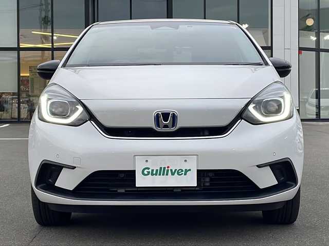ホンダ フィット e:HEVホーム カーサ 青森県 2021(令3)年 3.1万km プラチナホワイトパール ・4WD/・寒冷地仕様/・コンフォートビューパッケージ/・純正ギャザーズナビ/・Bluetooth/・フルセグTV/・バックカメラ/・衝突軽減ブレーキ/・レーンキープアシスト/・レーダークルーズコントロール/・ドライブレコーダー/・コーナーセンサー/・ワイパーデアイサ/・オートマチックハイビーム/・シートヒーター/・スマートキー/・スペアキーあり/・USB端子/・ETC/・純正LEDヘッドライト/・純正16AW