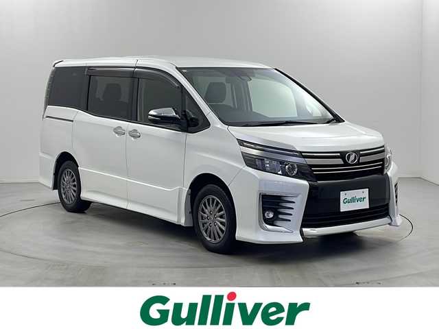 トヨタ ヴォクシー ZS 煌Ⅱ 栃木県 2016(平28)年 8.3万km ホワイトパールクリスタルシャイン アルパイン9型ナビ/　　CD/DVD/Bluetooth/AM/FM/フルセグTV/バックカメラ/ビルトインETC/トヨタセーフティセンス/・プリクラッシュセーフティ/・レーンデパーチャーアラート/・オートマチックハイビーム/12.8型フリップダウンモニター/両側パワースライドドア/純正15インチAW/純正フロアマット/純正ドアバイザー/革調シートカバー/オートライト/LEDヘッドライト/LEDフォグ/プッシュスタート/スマートキー