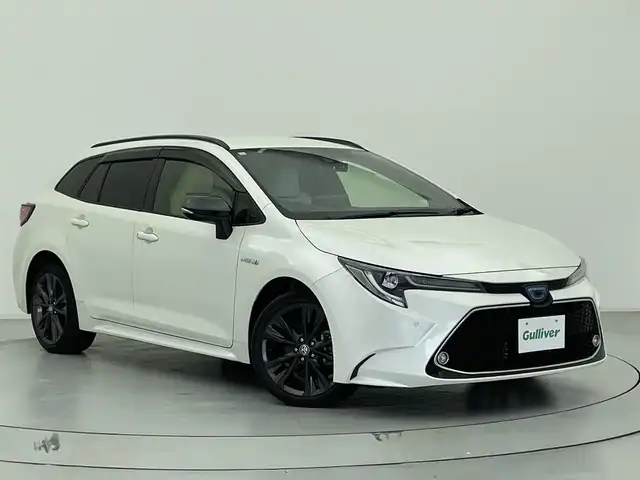 トヨタ カローラツーリング ハイブリッド ダブルバイビー 宮城県 2020(令2)年 5.3万km ホワイトパールクリスタルシャイン 純正9インチディスプレイオーディオ/フルセグ/ヘッドアップディスプレイ/ブラインドスポットモニター/バックカメラ/アダプティブ・クルーズ・コントロール/ETC2.0/前後ドライブレコーダー/ワイアレスチャージャー/オートホールド/ハーフレザーシート/シートヒーター/ステアリングスイッチ/ステアリングヒーター/社外17AW/純正17AW積/保証書/取扱説明書/スペアキー