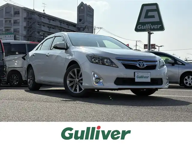トヨタ カムリ ハイブリット Gパッケージ プレミアムブラック 大分県 2013(平25)年 7.4万km ホワイトパールクリスタルシャイン ・純正SDナビ(CD/DVD/SD/BT)/・バックカメラ/・フルセグテレビ/・ETC/・ステアリングスイッチ/・クルーズコントロール/・運転席パワーシート/・オートエアコン/・純正フロアマット/・スマートキー/・プッシュスタート/・純正アルミホイール