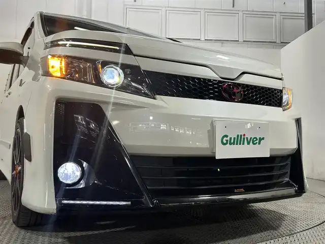 トヨタ ヴォクシー ZS G’s 大阪府 2016(平28)年 6.8万km ホワイトパールクリスタルシャイン ALPINE9incナビ(フルセグ/DVD再生/Bluetooth) Bカメラ 後席モニター ETC ハーフレザー 衝突軽減 トヨタセーフティセンス スマートキー Pスタート オートライト