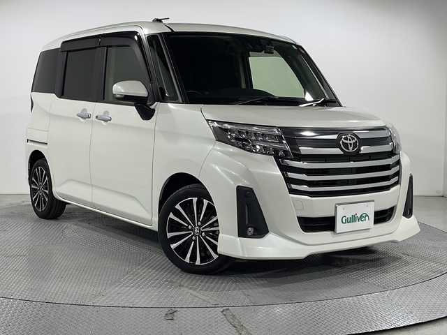 トヨタ ルーミー カスタムG－T 広島県 2023(令5)年 1.9万km パールホワイトⅢ 純正9型ディスプレイオーディオ/両側パワースライドドア/バックカメラ/レーダークルーズコントロール/衝突軽減ブレーキ/車線逸脱警報/オートハイビーム/誤発進抑制/前後コーナーセンサー/純正アルミホイール/LEDヘッドライト/オートライト/ETC/ドラレコ