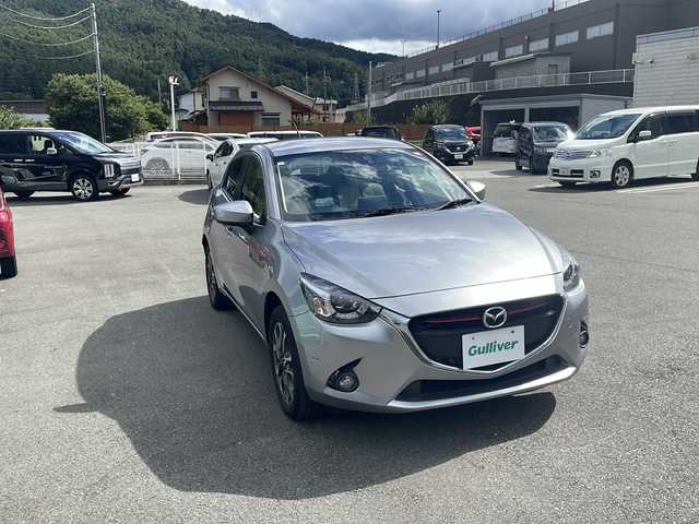 マツダ デミオ XD ツーリング Lパッケージ 山梨県 2015(平27)年 2.7万km アルミニウムメタリック ４WD/純正ナビ　/フルセグ　/ＥＴＣ　/バックカメラ　/Ｂｌｕｅｔｏｏｔｈ接続　/衝突軽減装置　/ＨＵＤ　/ＢＳＭ　/オートマチックハイビーム　/ハーフレザーシート　/オートライト　/オートエアコン　/ＬＥＤヘッドライト