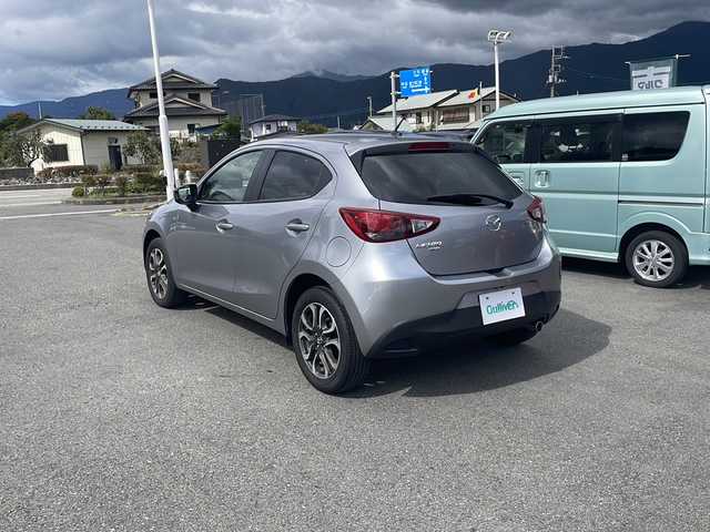 マツダ デミオ XD ツーリング Lパッケージ 山梨県 2015(平27)年 2.7万km アルミニウムメタリック ４WD/純正ナビ　/フルセグ　/ＥＴＣ　/バックカメラ　/Ｂｌｕｅｔｏｏｔｈ接続　/衝突軽減装置　/ＨＵＤ　/ＢＳＭ　/オートマチックハイビーム　/ハーフレザーシート　/オートライト　/オートエアコン　/ＬＥＤヘッドライト