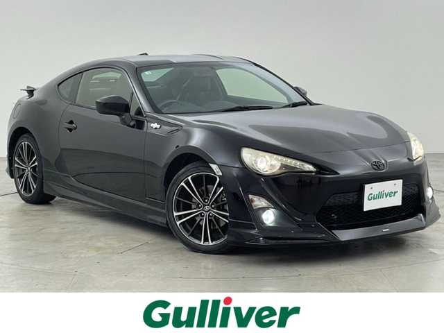 トヨタ ８６ GT リミテッド 福岡県 2012(平24)年 13.9万km クリスタルブラックシリカ モデリスタエアロ　/純正ナビ（フルセグＴＶ）　/バックカメラ　/ＥＴＣ　/パドルシフト　/ＭＴモード付　/シートヒーター　/ハーフレザーシート　/革巻きステアリング　/社外リアウィング　/純正１７インチＡＷ　/ＬＥＤライト