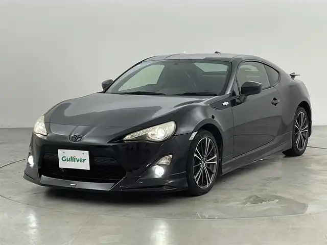 トヨタ ８６ GT リミテッド 福岡県 2012(平24)年 13.9万km クリスタルブラックシリカ モデリスタエアロ　/純正ナビ（フルセグＴＶ）　/バックカメラ　/ＥＴＣ　/パドルシフト　/ＭＴモード付　/シートヒーター　/ハーフレザーシート　/革巻きステアリング　/社外リアウィング　/純正１７インチＡＷ　/ＬＥＤライト