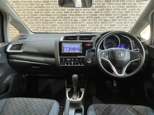 ホンダ フィット 13G FパックコンフォートED 道央・札幌 2016(平28)年 12.7万km プレミアムディープモカパール ４WD/横滑り防止装置/アイドリングストップ/ヘッドライトレベライザー/シートヒーター/純正ナビ/バックカメラ/ワンセグTV/ステアリングスイッチ/ETC/熱線入りフロントウインドウ/ヒーテッドドアミラー/チップアップリヤシート/ドアバイザー/１５インチアルミホイール/純正フロアマット