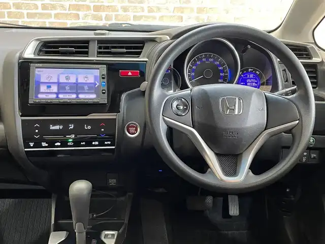 ホンダ フィット 13G FパックコンフォートED 道央・札幌 2016(平28)年 12.7万km プレミアムディープモカパール ４WD/横滑り防止装置/アイドリングストップ/ヘッドライトレベライザー/シートヒーター/純正ナビ/バックカメラ/ワンセグTV/ステアリングスイッチ/ETC/熱線入りフロントウインドウ/ヒーテッドドアミラー/チップアップリヤシート/ドアバイザー/１５インチアルミホイール/純正フロアマット