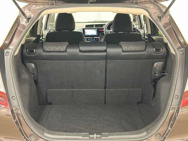 ホンダ フィット 13G FパックコンフォートED 道央・札幌 2016(平28)年 12.7万km プレミアムディープモカパール ４WD/横滑り防止装置/アイドリングストップ/ヘッドライトレベライザー/シートヒーター/純正ナビ/バックカメラ/ワンセグTV/ステアリングスイッチ/ETC/熱線入りフロントウインドウ/ヒーテッドドアミラー/チップアップリヤシート/ドアバイザー/１５インチアルミホイール/純正フロアマット