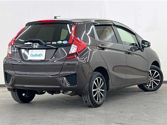 ホンダ フィット 13G FパックコンフォートED 道央・札幌 2016(平28)年 12.7万km プレミアムディープモカパール ４WD/横滑り防止装置/アイドリングストップ/ヘッドライトレベライザー/シートヒーター/純正ナビ/バックカメラ/ワンセグTV/ステアリングスイッチ/ETC/熱線入りフロントウインドウ/ヒーテッドドアミラー/チップアップリヤシート/ドアバイザー/１５インチアルミホイール/純正フロアマット