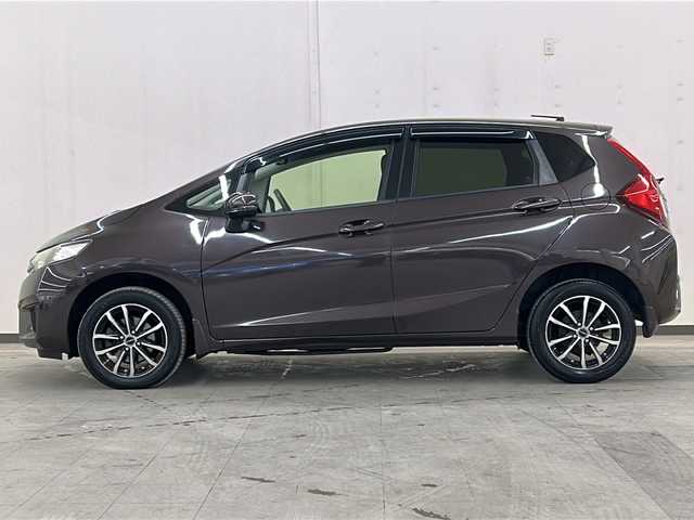 ホンダ フィット 13G FパックコンフォートED 道央・札幌 2016(平28)年 12.7万km プレミアムディープモカパール ４WD/横滑り防止装置/アイドリングストップ/ヘッドライトレベライザー/シートヒーター/純正ナビ/バックカメラ/ワンセグTV/ステアリングスイッチ/ETC/熱線入りフロントウインドウ/ヒーテッドドアミラー/チップアップリヤシート/ドアバイザー/１５インチアルミホイール/純正フロアマット