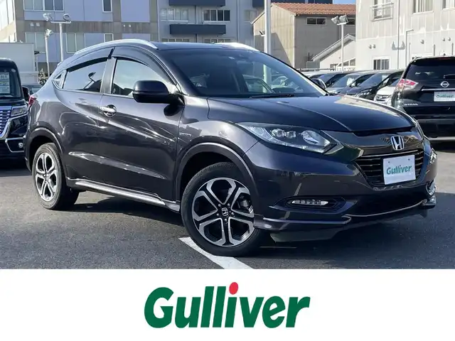 ホンダ ヴェゼル ハイブリッド Z ホンダセンシング 島根県 2016(平28)年 6.3万km ルーセブラックM 純正ＳＤナビ　/フルセグTV　/ＤＶＤ再生　/Ｂｌｕｅｔｏｏｔｈ接続　/バックカメラ　/ビルトインＥＴＣ　/ドライブレコーダー　/アダプティブクルーズコントロール/衝突軽減システム　/前席シートヒーター　/スマートキー/純正ＬＥＤヘッドライト/純正１７インチアルミホイール　/純正フロアマット　/保証書/取扱説明書/スペアキー1本