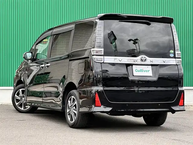 トヨタ ヴォクシー ZS 煌Ⅱ 宮城県 2019(平31)年 5万km ブラック 純正ナビ/(フルセグTV/CD/SD/BT)/バックカメラ/プリクラッシュセーフティー/レーンディパーチャーアラート/クリアランスソナー/先行車発進告知/クルーズコントロール/パーキングサポートブレーキ/オートハイビーム/ドライブレコーダー前後/ビルトインETC/デュアルオートエアコン/MTモード付AT/ドライブセレクト/革巻きステアリング/ステアリングスイッチ/オートライト/アイドリングストップ/両側パワースライドドア/ふらつき防止/プッシュスタート＆スマートキー/ウインカー付き電動格納ミラー/ドアバイザー/フロアマット/キャンセラー/LEDヘッドライト/フォグランプ/純正16インチAW