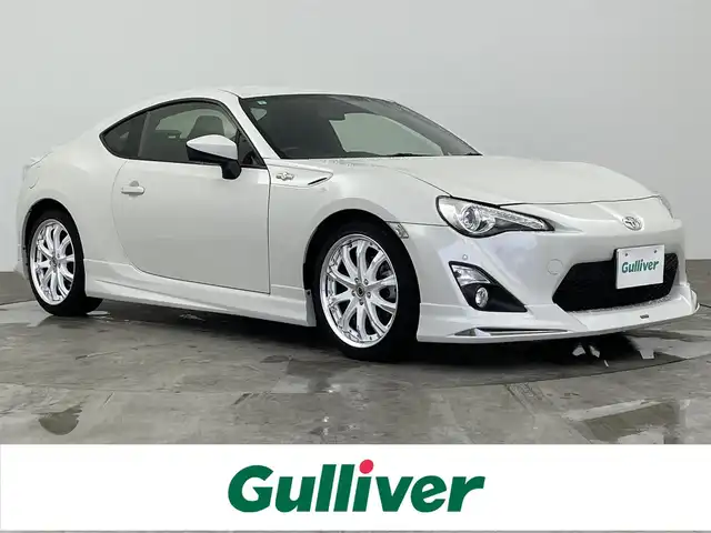 トヨタ ８６ GT 大分県 2015(平27)年 2.7万km クリスタルホワイトパール 社外ナビ/（フルセグ/CD/DVD/Bluetooth）/モデリスタエアロ/クスコタワーバー/パドルシフト/走行モード切替/（SNOW/sports）/クリアランスソナー/バックカメラ　/ETC/オートライト/オートエアコン/社外アルミホイール/プッシュスタート・スマートキー/保証書・取扱説明書/スペアキー
