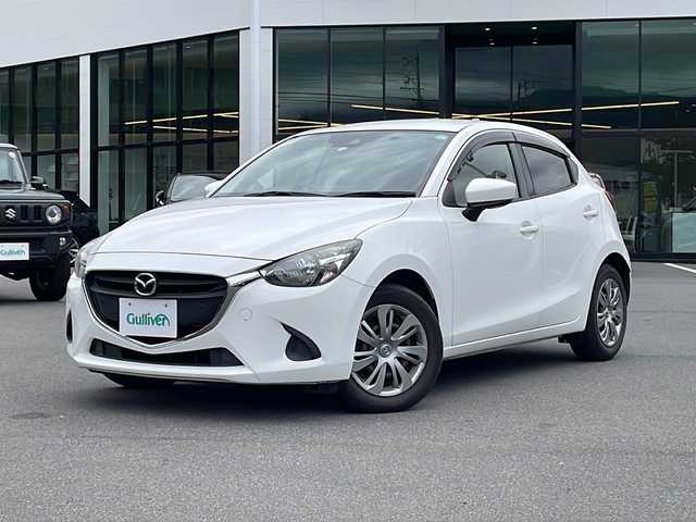 マツダ デミオ 13S 熊本県 2018(平30)年 6万km アークティックホワイト 純正SDナビ/FM/AM/USB/AUX/BluetoothAudio/ドライブレコーダー/コーナーセンサー/オートハイビーム/オートライト/スマートキー/横滑り防止装置/衝突軽減システム/アイドリングストップ/ヘッドライトレベライザー/スペアキー1本あり/フロアマット/Wエアバッグ/ABS