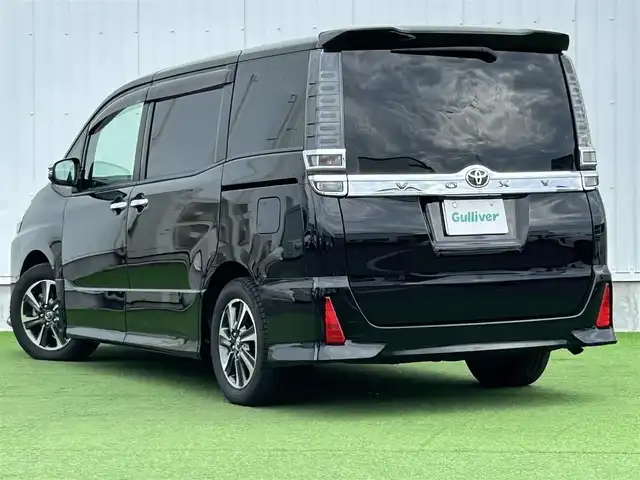 トヨタ ヴォクシー ZS 煌 香川県 2019(平31)年 2.5万km ブラック 登録時走行距離：24178km/社外１１インチナビ　/フルセグＴＶ　/社外フリップダウン　/ＥＴＣ　/ドラレコ　/両パワスラ/バックカメラ　/クルコン　/コーナーセンサー　/ＬＥＤヘッドライト　/オートライト　/横滑り防止　/スマートキー　/プッシュスタート