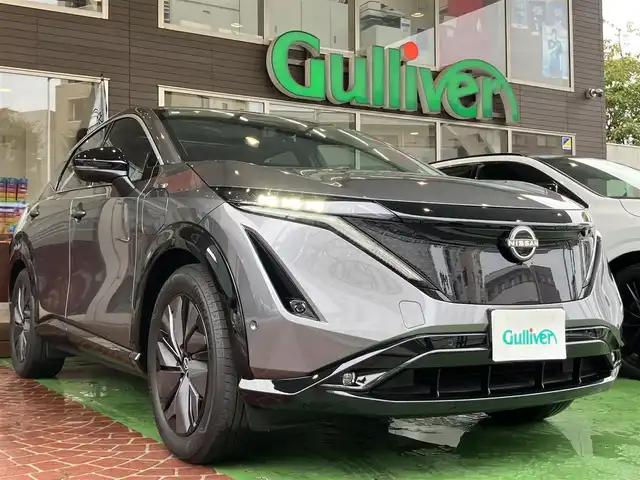 日産 アリア B6 神奈川県 2022(令4)年 1.4万km ダークメタルグレー 純正ナビ/・AM/FM/HDMI/BT/・AppleCarPlay/AndroidAuto/・フルセグTV/全周囲カメラ/・フロント/バック/サイド/プロパイロット2.0/衝突防止支援/踏み間違い防止支援/後側方車両検知支援/後側方車両衝突防止支援/車両逸脱警報/車両逸脱防止支援/駐車支援/オートマチックハイビーム/純正革巻きステアリング/・ステアリングスイッチ/レザーシート/・D/N席パワーシート/・D/N席シートヒーター/・全席シートヒーター/オートライト/・LEDライト/・フォグランプ/デジタルインナーミラー/電動アームレスト/サンルーフ/ETC2.0/BOSEプレミアムサウンド/前後ドライブレコーダー/電動格納ミラー/・ウィンカーミラー/e-pedal/置くだけ充電/電動サイドブレーキ/・オートホールドボタン/パワーバックドア/純正ドアバイザー/純正アルミホイール/純正フロアマット/スマートキー/・スペアキー