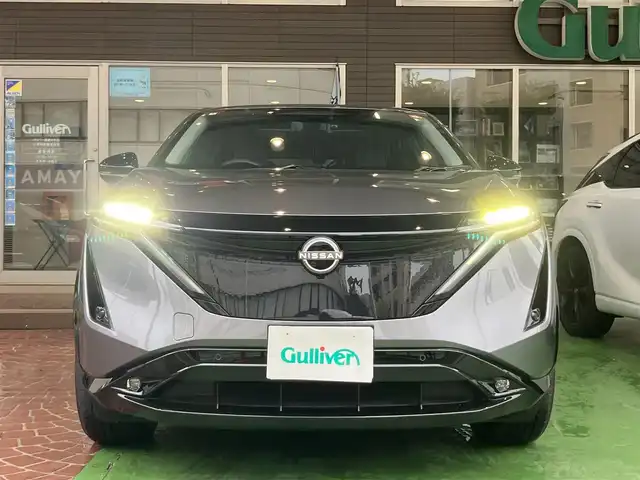 日産 アリア B6 神奈川県 2022(令4)年 1.4万km ダークメタルグレー 純正ナビ/・AM/FM/HDMI/BT/・AppleCarPlay/AndroidAuto/・フルセグTV/全周囲カメラ/・フロント/バック/サイド/プロパイロット2.0/衝突防止支援/踏み間違い防止支援/後側方車両検知支援/後側方車両衝突防止支援/車両逸脱警報/車両逸脱防止支援/駐車支援/オートマチックハイビーム/純正革巻きステアリング/・ステアリングスイッチ/レザーシート/・D/N席パワーシート/・D/N席シートヒーター/・全席シートヒーター/オートライト/・LEDライト/・フォグランプ/デジタルインナーミラー/電動アームレスト/サンルーフ/ETC2.0/BOSEプレミアムサウンド/前後ドライブレコーダー/電動格納ミラー/・ウィンカーミラー/e-pedal/置くだけ充電/電動サイドブレーキ/・オートホールドボタン/パワーバックドア/純正ドアバイザー/純正アルミホイール/純正フロアマット/スマートキー/・スペアキー