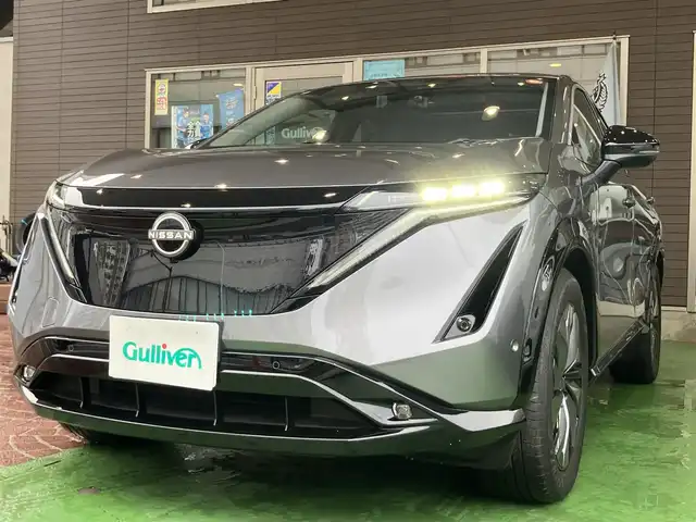 日産 アリア B6 神奈川県 2022(令4)年 1.4万km ダークメタルグレー 純正ナビ/・AM/FM/HDMI/BT/・AppleCarPlay/AndroidAuto/・フルセグTV/全周囲カメラ/・フロント/バック/サイド/プロパイロット2.0/衝突防止支援/踏み間違い防止支援/後側方車両検知支援/後側方車両衝突防止支援/車両逸脱警報/車両逸脱防止支援/駐車支援/オートマチックハイビーム/純正革巻きステアリング/・ステアリングスイッチ/レザーシート/・D/N席パワーシート/・D/N席シートヒーター/・全席シートヒーター/オートライト/・LEDライト/・フォグランプ/デジタルインナーミラー/電動アームレスト/サンルーフ/ETC2.0/BOSEプレミアムサウンド/前後ドライブレコーダー/電動格納ミラー/・ウィンカーミラー/e-pedal/置くだけ充電/電動サイドブレーキ/・オートホールドボタン/パワーバックドア/純正ドアバイザー/純正アルミホイール/純正フロアマット/スマートキー/・スペアキー