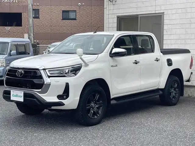 トヨタ ハイラックス Z 福岡県 2022(令4)年 2.5万km スーパーホワイトⅡ ワンオーナー/4WD/純正メモリナビ【NSZT-W68T】/　(AM/FM/CD/DVD/Bluetooth/フルセグTV)/バックカメラ/運転支援装置/・プリクラッシュセーフティ/・レーンディパーチャーアラート/・ロードサインアシスト/・レーダークルーズコントロール/・先行車発進告知/・クリアランスソナー/・リヤデフロック/・ダウンヒルアシストコントロールシステム/荷台トノカバー/パワーヒーター/排出ガス浄化/純正17インチアルミホイール/革巻きステアリング/ステアリングスイッチ/純正フロアマット/純正ETC/スペアタイヤ/アクセサリーソケット/ISOFIX/スペアキー×2(鍵のみ)/保証書/取扱説明書/ナビ取扱説明書