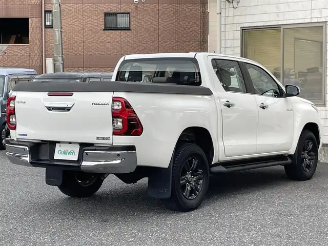 トヨタ ハイラックス Z 福岡県 2022(令4)年 2.5万km スーパーホワイトⅡ ワンオーナー/4WD/純正メモリナビ【NSZT-W68T】/　(AM/FM/CD/DVD/Bluetooth/フルセグTV)/バックカメラ/運転支援装置/・プリクラッシュセーフティ/・レーンディパーチャーアラート/・ロードサインアシスト/・レーダークルーズコントロール/・先行車発進告知/・クリアランスソナー/・リヤデフロック/・ダウンヒルアシストコントロールシステム/荷台トノカバー/パワーヒーター/排出ガス浄化/純正17インチアルミホイール/革巻きステアリング/ステアリングスイッチ/純正フロアマット/純正ETC/スペアタイヤ/アクセサリーソケット/ISOFIX/スペアキー×2(鍵のみ)/保証書/取扱説明書/ナビ取扱説明書