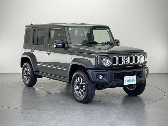 スズキ ジムニー ノマド FC 長野県 2025(令7)年 0.1万km未満 緑 4WD/届出済未使用車/登録時走行距離：25km/アダプティブクルーズコントロール/レーンキープアシスト/車線逸脱警報/衝突軽減ブレーキ/後方コーナーセンサー/アイドリングストップ/オートマチックハイビーム/ダウンヒルアシストコントロール/センターデフロック/ビルトインETC/LEDヘッドライト/オートライト/ヘッドライトウォーッシャー/電動格納ミラー/ウィンカーミラー/ドアミラーヒーター/純正15インチAW装着/プッシュスタート/スマートキー/スペアキー1本