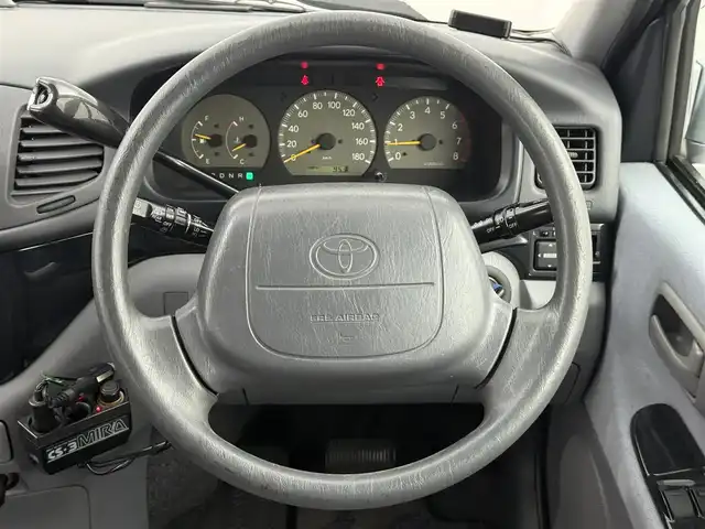 トヨタ ハイエース レジアス ウインドツアラー 愛知県 1997(平9)年 13.2万km ブルーイッシュシルバーM 対面シート/ツインサンルーフ/ルーフレール/カーテン/純正OPナビ/ドラレコ/WAC/ECT/電格ミラー/ドアバイザー/ハロゲンヘッドライト/フォグランプ/純正アルミホイール/純正フロアマット