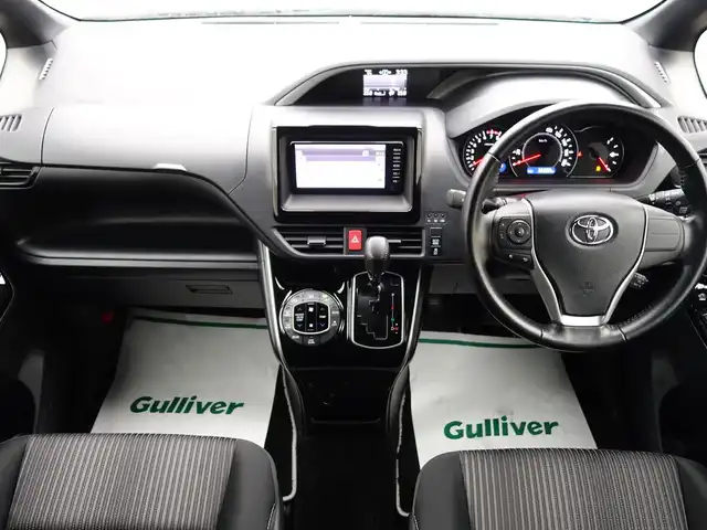 トヨタ ヴォクシー ZS 煌 山形県 2018(平30)年 3.7万km ボルドーマイカメタリック 4WD/衝突被害軽減システム/純正SDナビ/　　【CD BT ワンセグ AUX】/バックカメラ/両側パワースライドドア/クルーズコントロール/LEDオートライト/純正16インチアルミホイールアルミ/アイドリングストップ/ステアリングスイッチ/MTモード付AT/電動格納ウィンカーミラー/フォグランプ/スマートキー/ETC