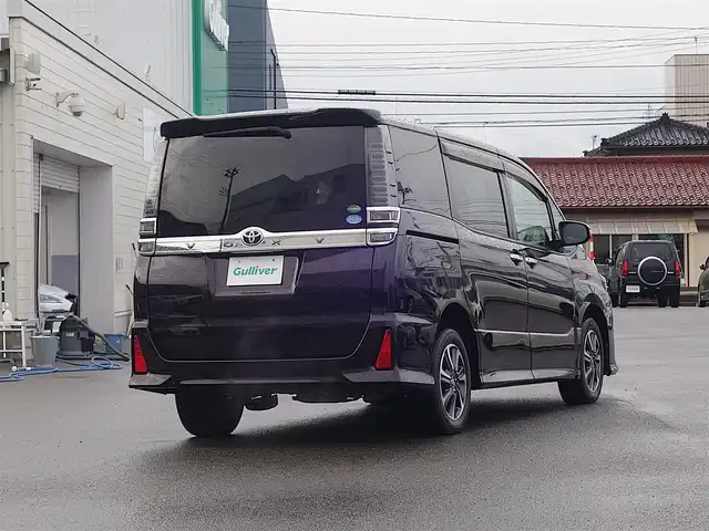 トヨタ ヴォクシー ZS 煌 山形県 2018(平30)年 3.7万km ボルドーマイカメタリック 4WD/衝突被害軽減システム/純正SDナビ/　　【CD BT ワンセグ AUX】/バックカメラ/両側パワースライドドア/クルーズコントロール/LEDオートライト/純正16インチアルミホイールアルミ/アイドリングストップ/ステアリングスイッチ/MTモード付AT/電動格納ウィンカーミラー/フォグランプ/スマートキー/ETC