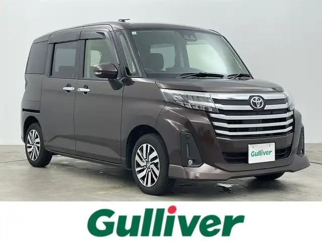 トヨタ ルーミー カスタムG 岡山県 2023(令5)年 2.3万km プラムブラウンパールクリスタルシャイン 純正９インチディスプレイオーディオ/（AMFM/BT/フルセグTV）/バックカメラ/ビルトインETC/LEDヘッドライト/LEDフォグランプ/オートライト/レーダークルーズコントロール/両側パワースライドドア/純正14インチアルミホイール/オートブレーキホールド/ISOFIX/後席サンシェイド/ステアリングスイッチ/チルトステアリング/シートリフター/ウインカーミラー/ドアバイザー/スマートキー×2/新車保証書/取扱説明書
