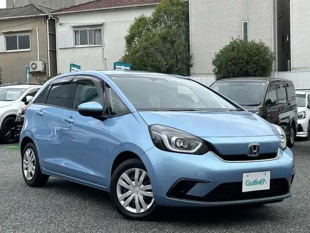 ホンダ フィット e:HEVホーム 兵庫県 2020(令2)年 9.8万km ライトブルー ・ワンオーナー/・純正9インチプレミアムインターナビ（VXU-205FTi）/・地デジ/CD/DVD/BT/USB/・バックカメラ/・ステアリングリモコン/・ハーフレザーシート/・ビルトインETC/・ドライブレコーダー（前後）/・オートLEDヘッドランプ/・アダプティブクルーズコントロール/・CMBS警告/・先行車発進お知らせ/・路外逸脱抑制制御/・レーンキープアシストシステム/・標識認識機能/・コーナーセンサー/・R3/4/5ディーラー点検記録簿/・取説/保証書/ナビ説後送