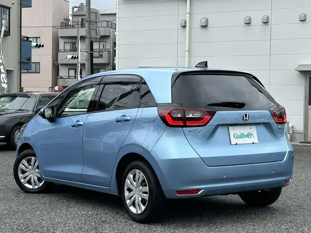 ホンダ フィット e:HEVホーム 兵庫県 2020(令2)年 9.8万km ライトブルー ・ワンオーナー/・純正9インチプレミアムインターナビ（VXU-205FTi）/・地デジ/CD/DVD/BT/USB/・バックカメラ/・ステアリングリモコン/・ハーフレザーシート/・ビルトインETC/・ドライブレコーダー（前後）/・オートLEDヘッドランプ/・アダプティブクルーズコントロール/・CMBS警告/・先行車発進お知らせ/・路外逸脱抑制制御/・レーンキープアシストシステム/・標識認識機能/・コーナーセンサー/・R3/4/5ディーラー点検記録簿/・取説/保証書/ナビ説後送